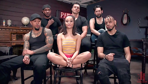 Busty brunette with a slender body is having sex with two guys