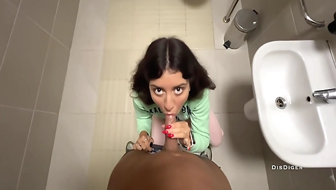 Amateur brunette gets her pussy fucked in public toilet